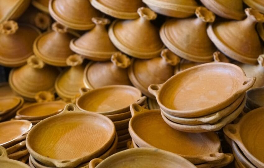 An assortment of stacked, finished terracotta dishes and tagines at the Oued Laou cooperative.