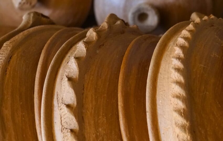Close-up detail of the decorative scalloped edge on traditional Moroccan tagine lids.