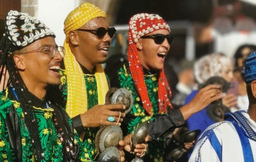 gnawa musicians during the opening parade for gnawa festival in essaouira