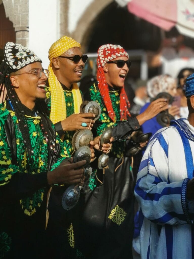 gnawa musicians during the opening parade for gnawa festival in essaouira